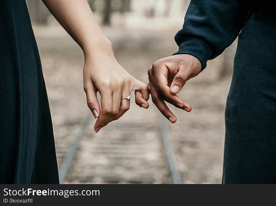 Man in Black Long-sleeved Shirt and Woman in Black Dress