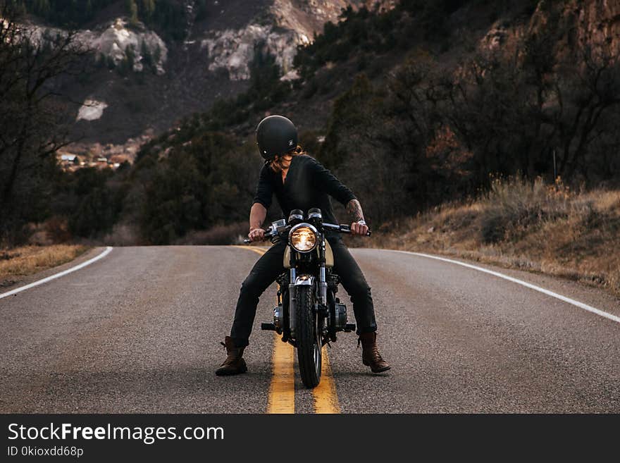 Man Riding Boxer Motorcycle on Road