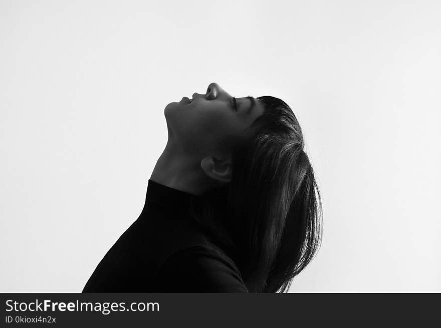 Female Grayscale Photo Facing Upward