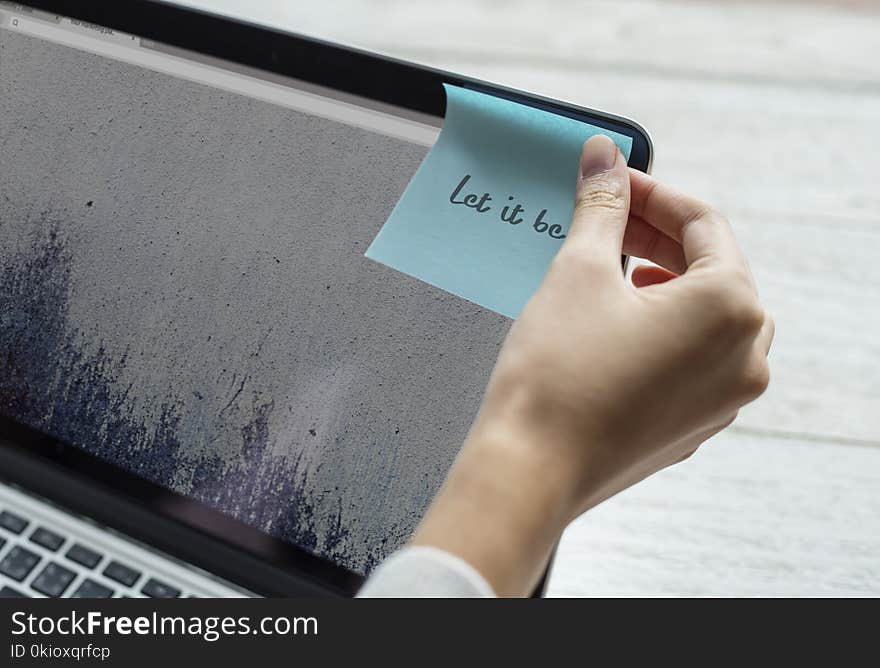 Person Holding Blue Sticky Note