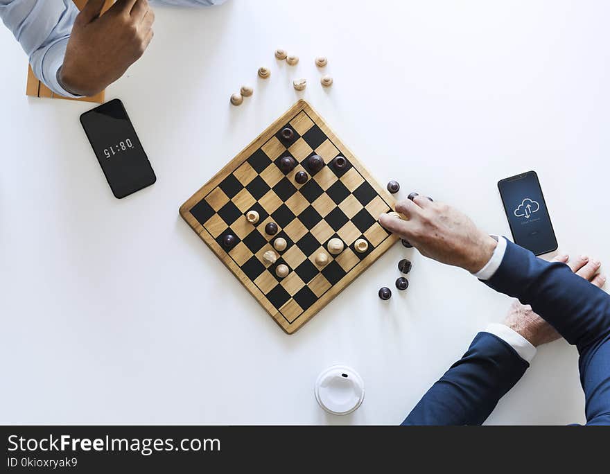 Flat Lay Photography of Two Men Playing Chess