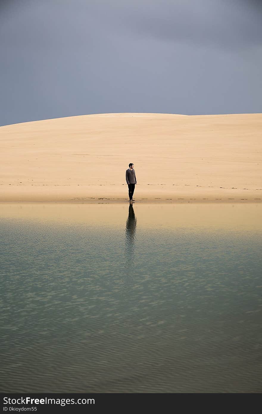 Man Standing on Seashore