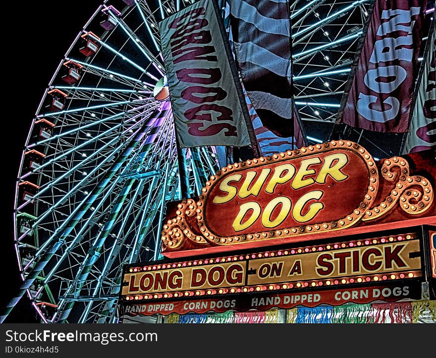 Super Dog Hot Dog Food Stall in Front of Ferris Wheel during Nighttime