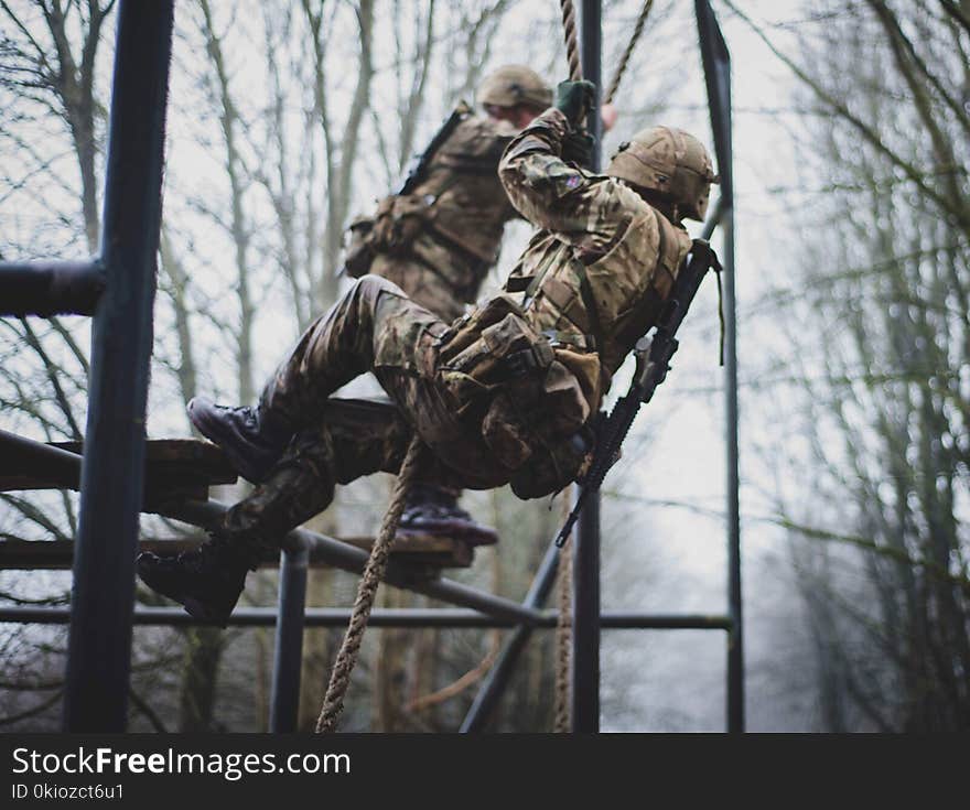 Soldier Climbing on Rope