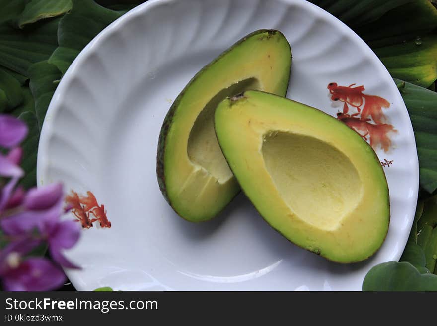 Sliced Avocado Fruits on Round White Ceramic Plate