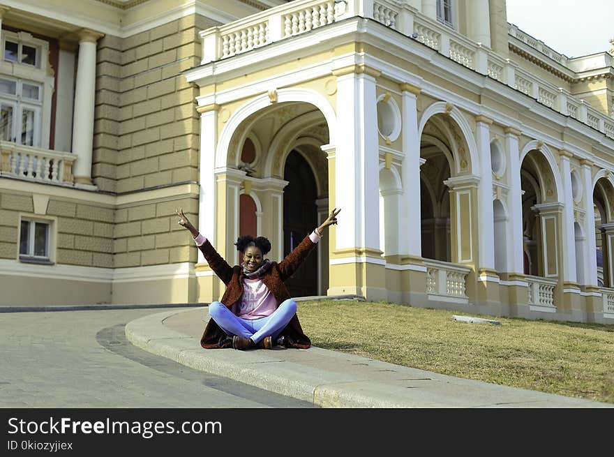 Photo of Woman Sitting on Ground