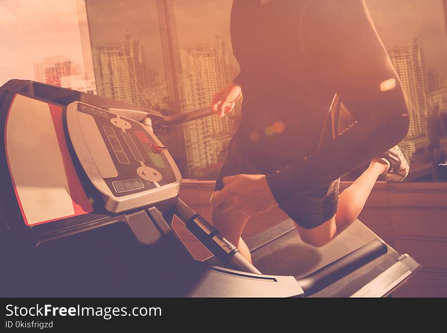 Man running in a gym on a treadmill. Man running in a gym on a treadmill