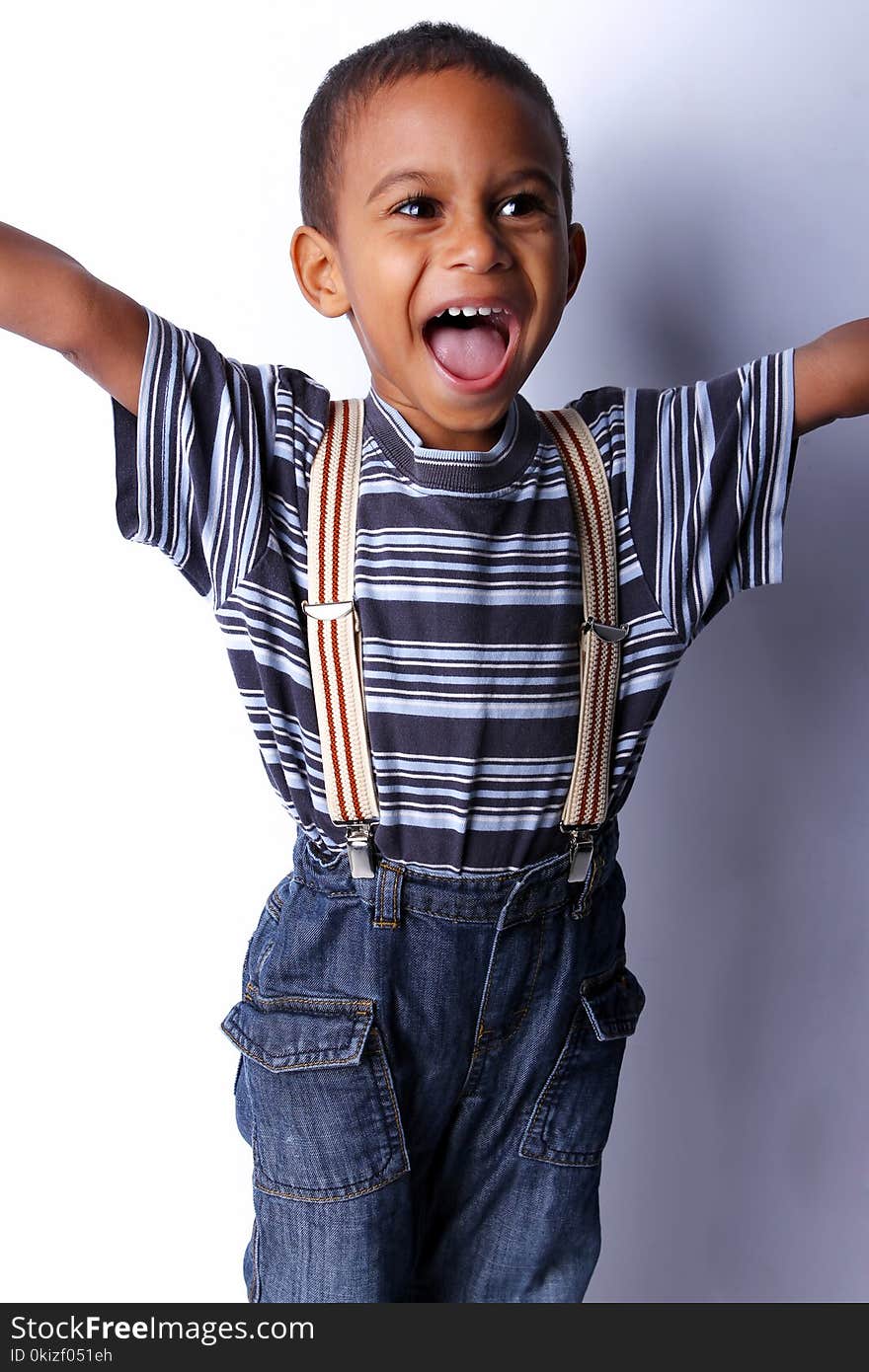 Happy cute black african child in studio. Happy cute black african child in studio.