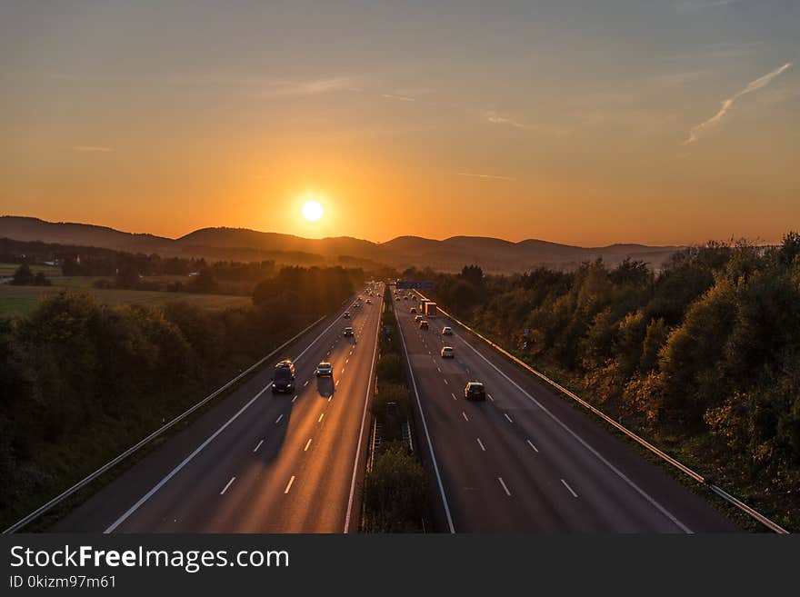 The road traffic on a motorway at sunset