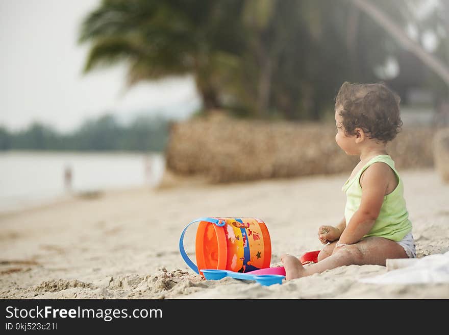 Baby Wearing Green Tank Top