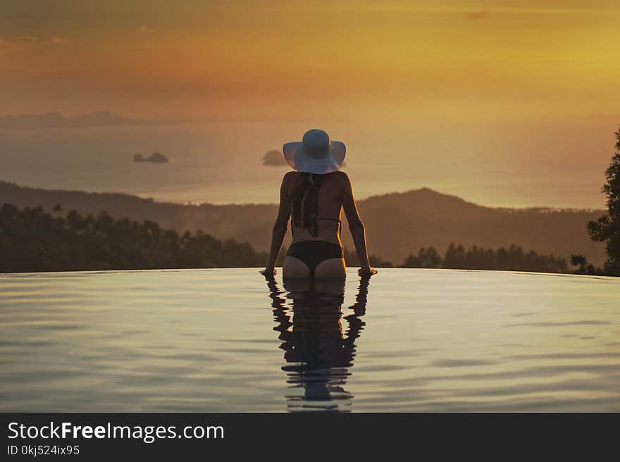 Woman At The Edge Of The Pool