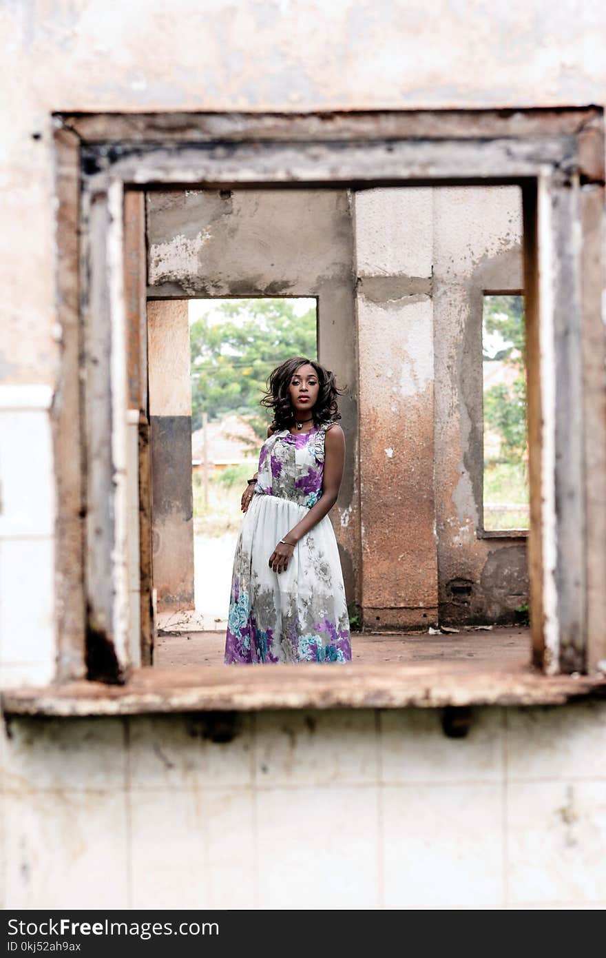 Woman Wearing White And Purple Floral Sleeveless Dress