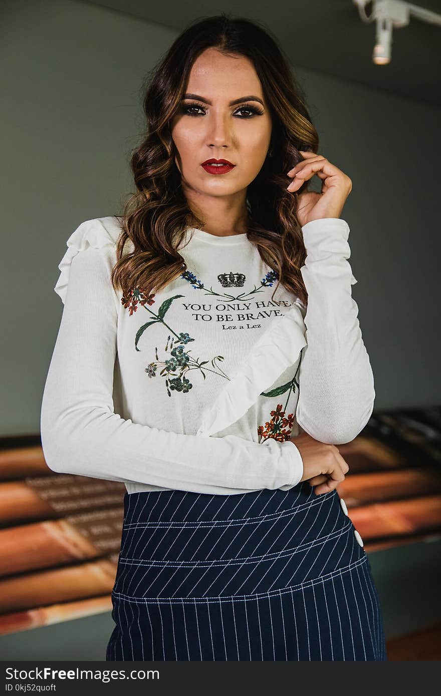 Woman Wearing White Long-sleeved Shirt And Blue Skirt