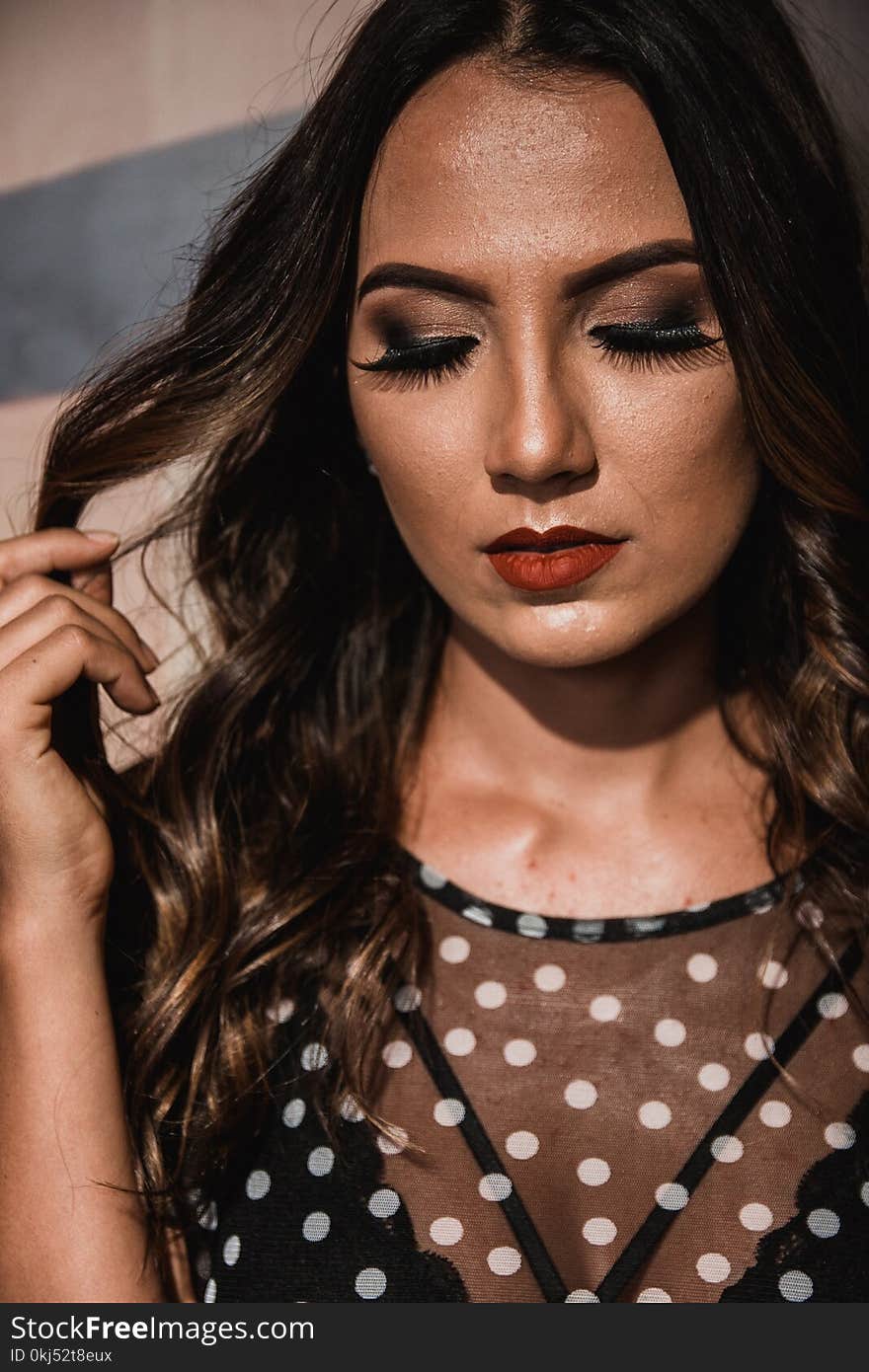 Woman Wearing Black and White Polka-dots Top