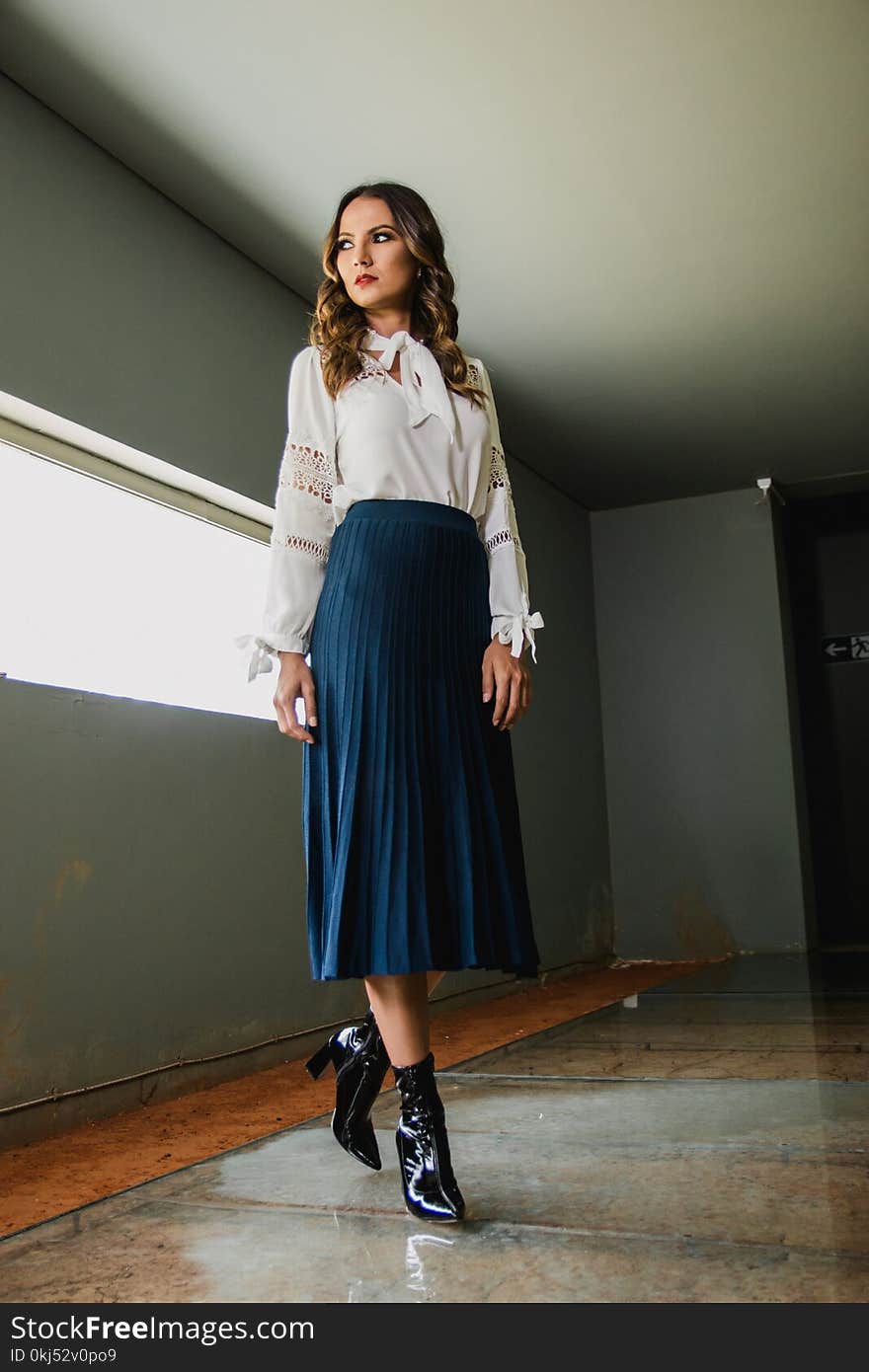 Woman Wearing White Long-sleeved Shirt and Blue Skirt