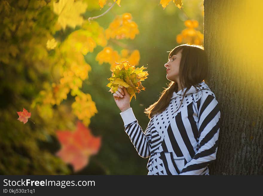 Woman Holding Leaves