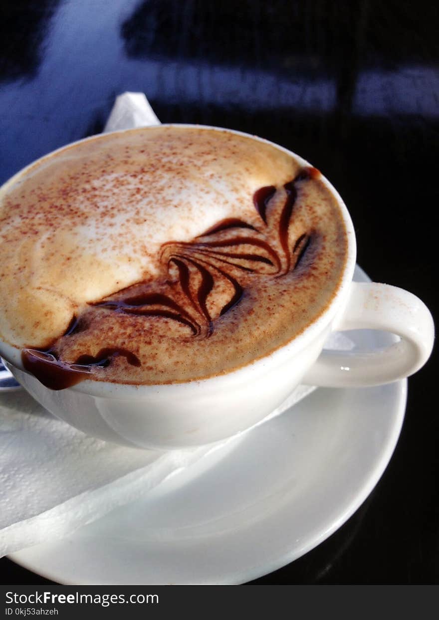 Cappuccino On White Ceramic Cup With Saucer