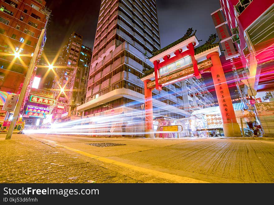 Time Lapse Photography Of Vehicles Passing Through China Town