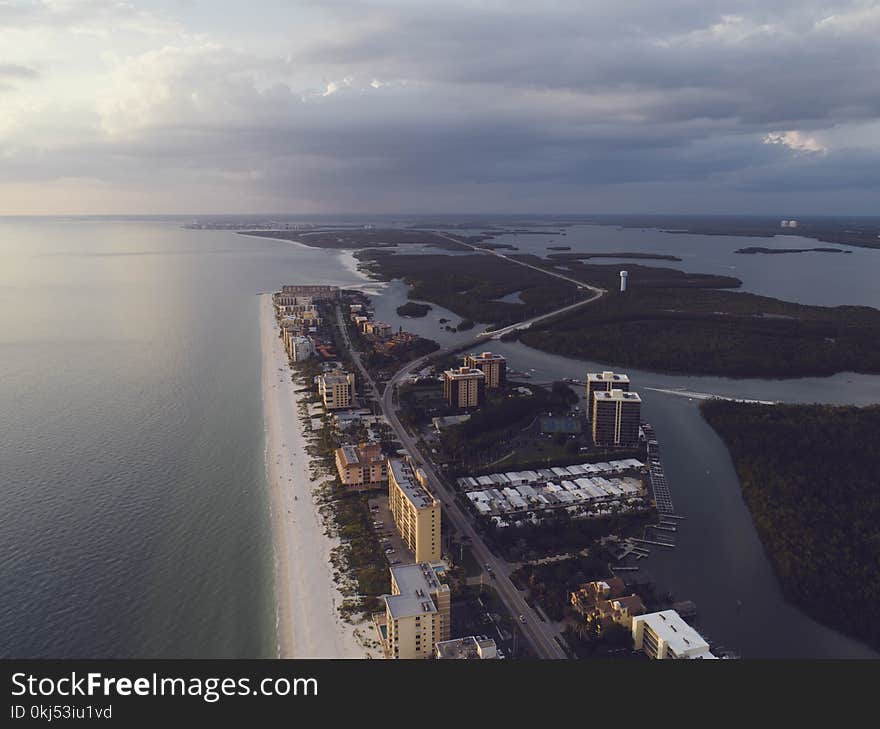 Aerial Photography of Islands With City Surrounded by Body of Water