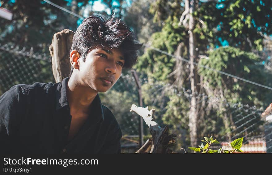 Man in Black Collared Shirt