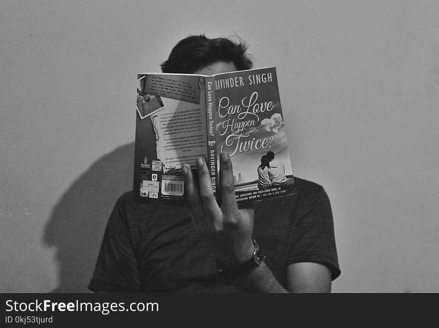 Grayscale Photography of Man Reading Book