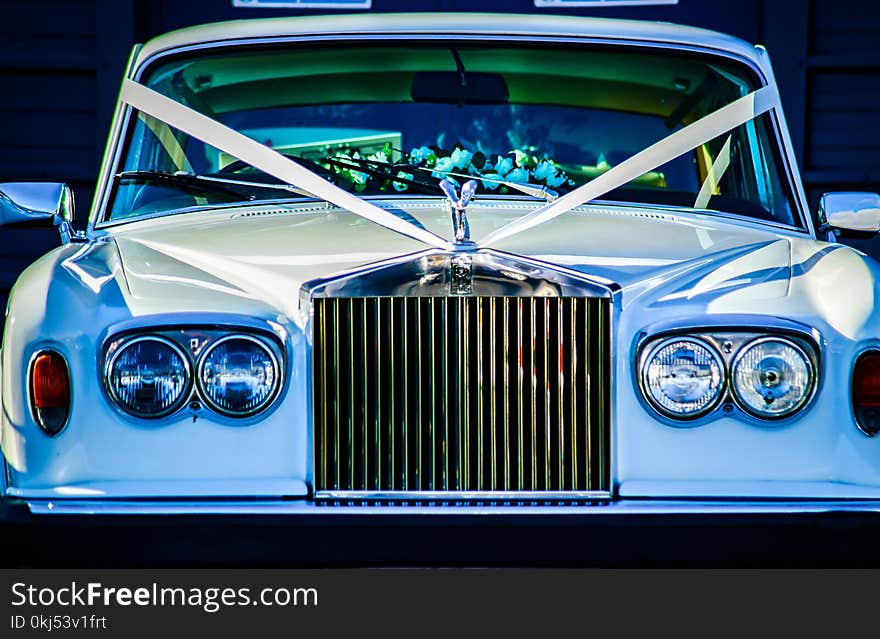 Closeup Photo of White Rolls Royce Vehicle