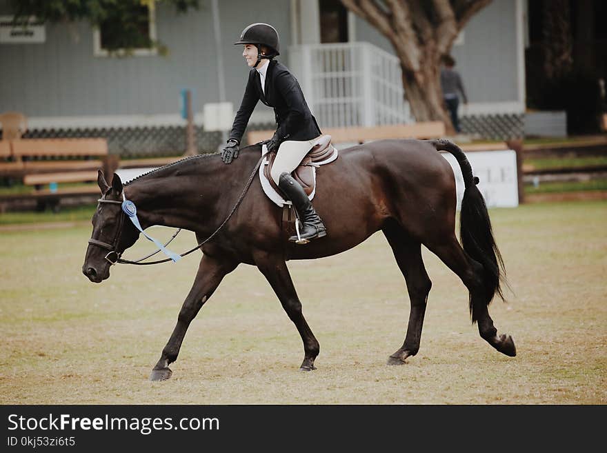 Woman Riding Horse