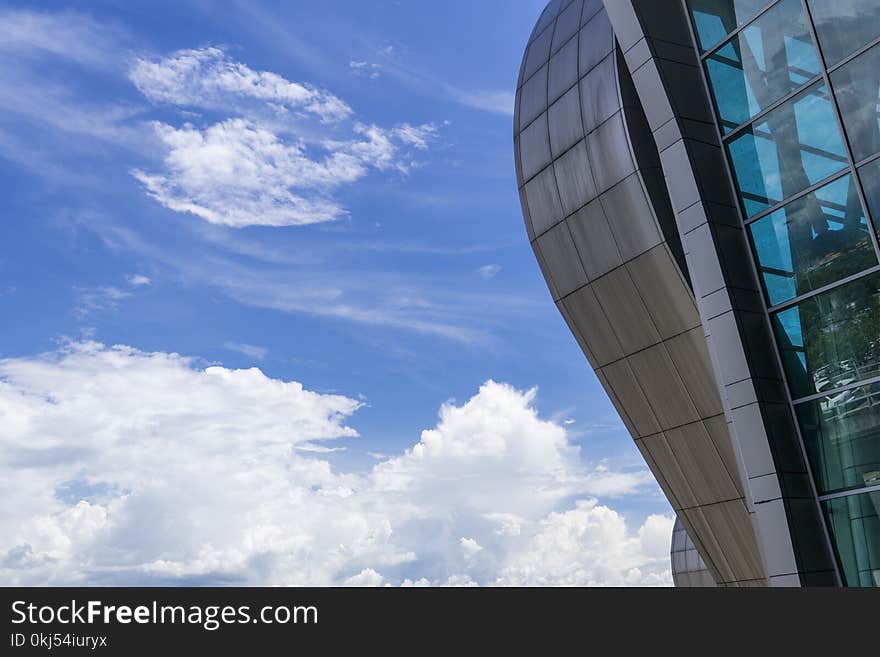 High-rise Building Under Blue Sky and White Clouds