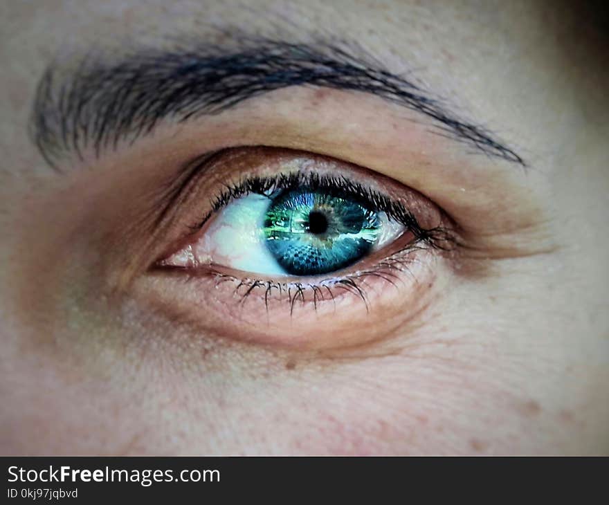 Close up photo of a deep blue eye of a woman