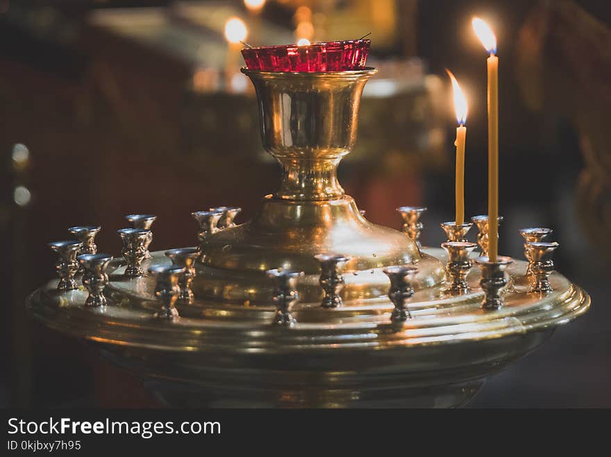 Metal candle light cresset in church. Metal candle light cresset in church.