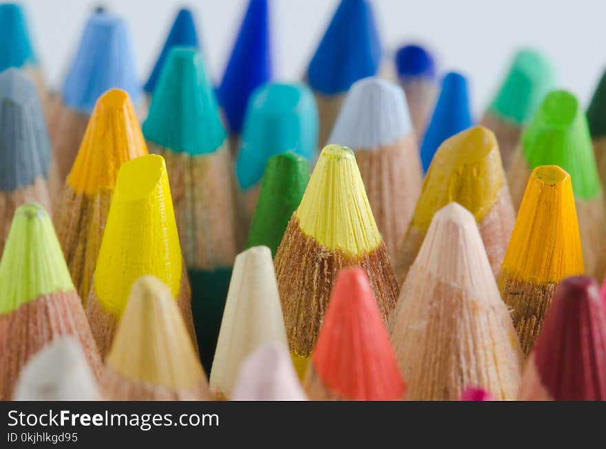 Colored pencils of wood. Macro of the tips.