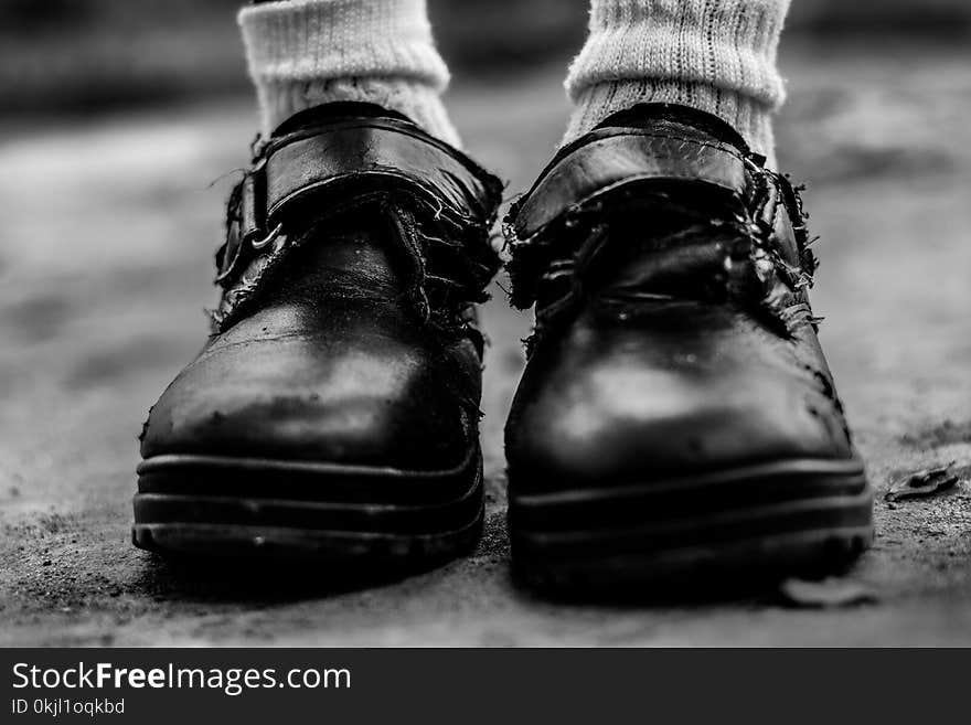 Grayscale Photo of Black Leather Hoop-and-look Shoies