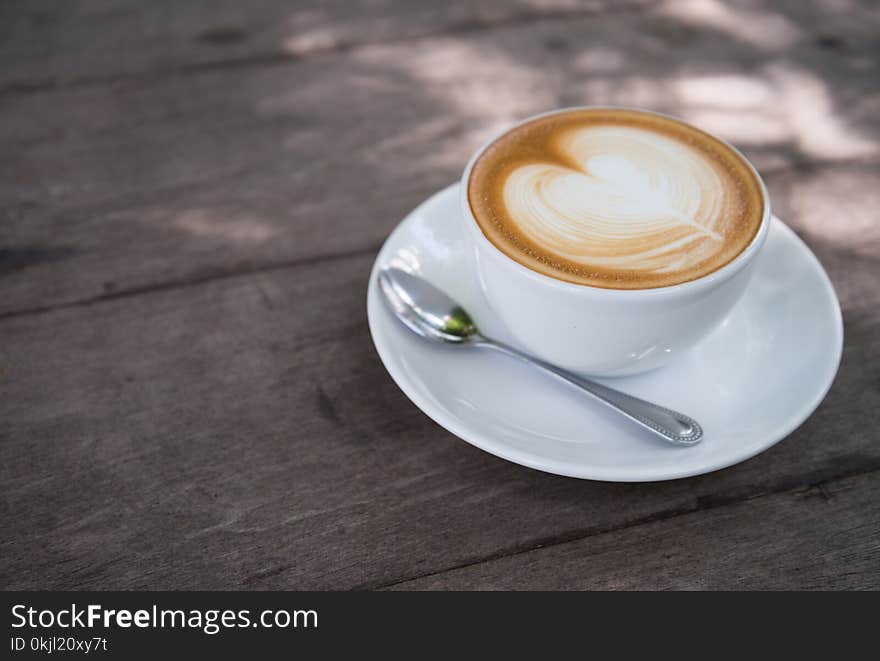 White Ceramic Coffee Cup With White Ceramic Saucer