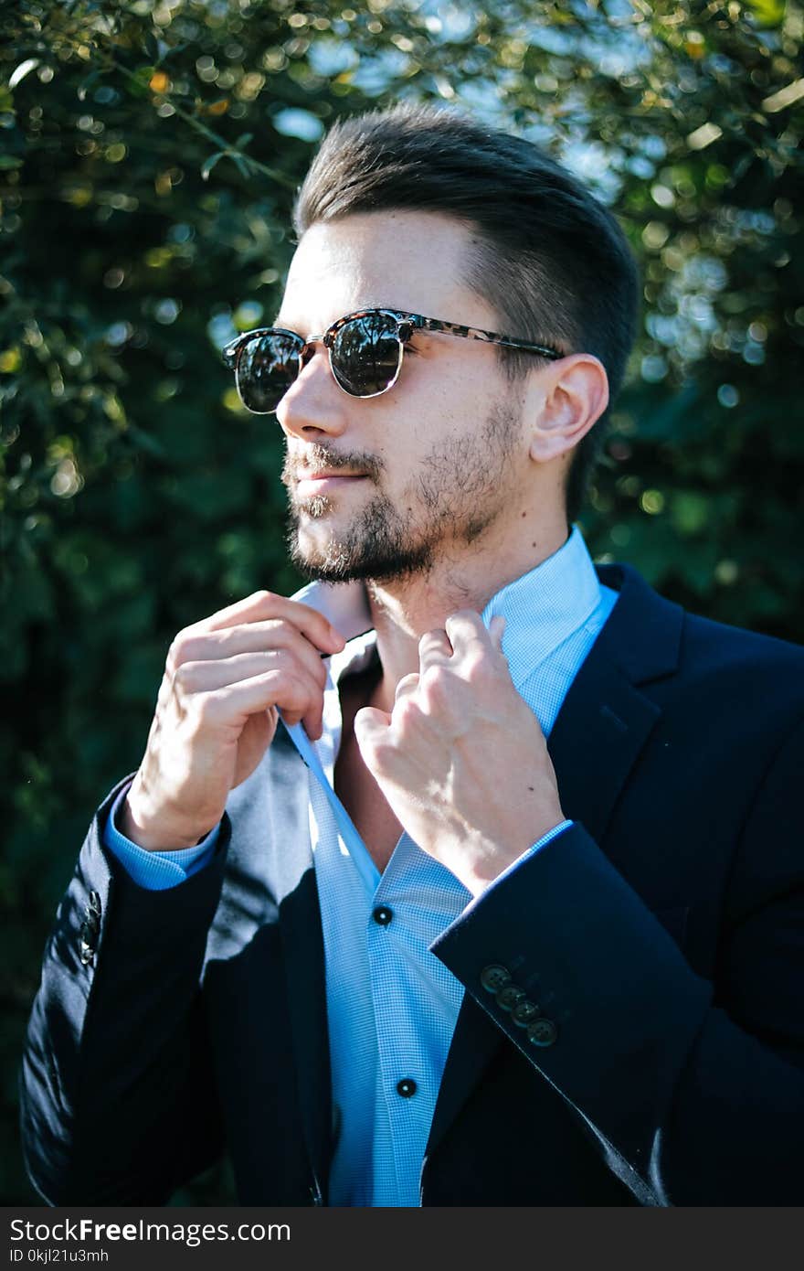 Man in Blue Dress Shirt and Black Formal Suit