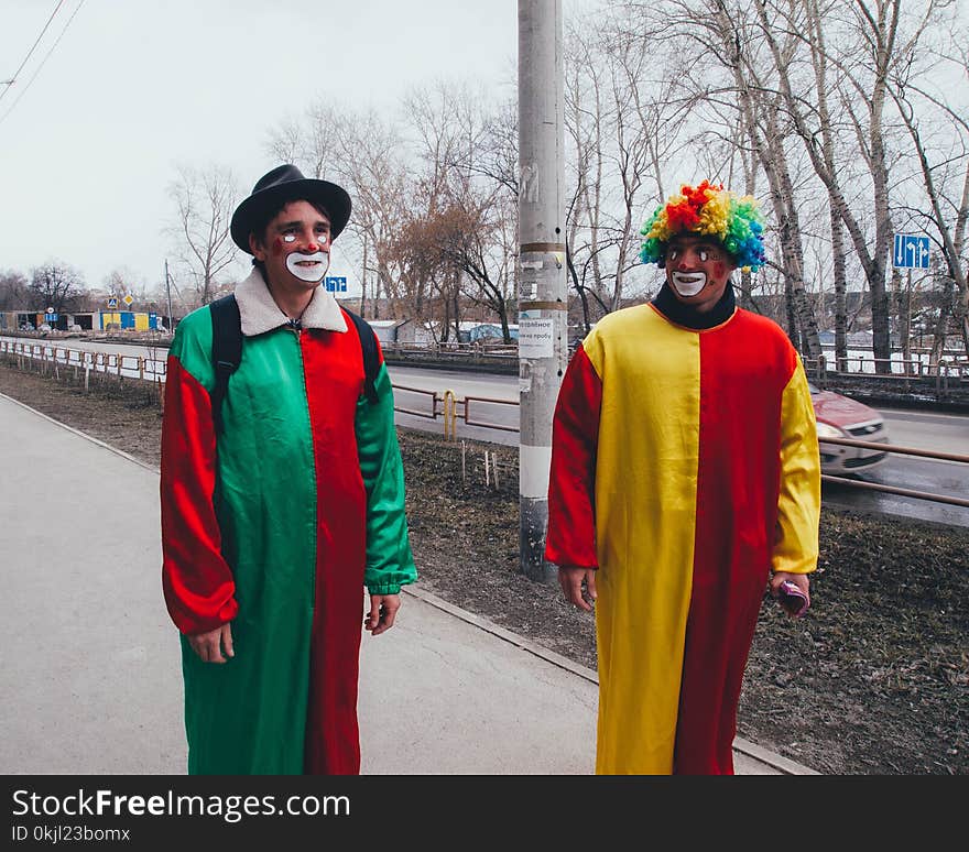 Photography of Two Clowns in the Street