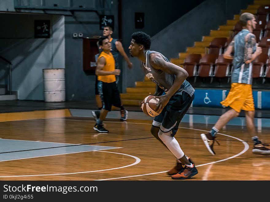 Basketball Player Holding Ball