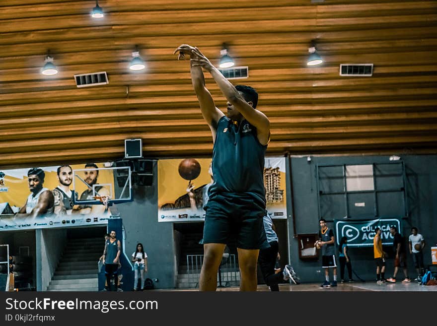 Black Haired Man Wearing Black Sleeveless Shirt and Black Shorts