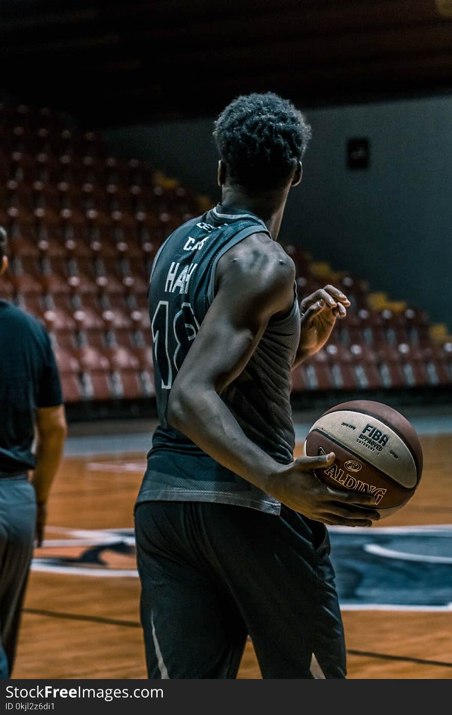 Man Holding Fiba Basketball