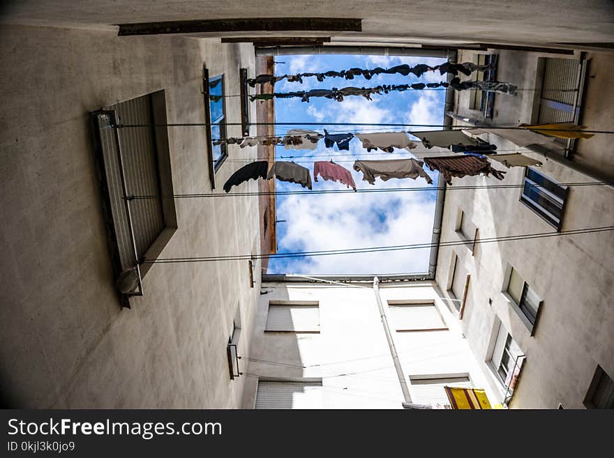 Assorted Clothes Hanging on Wire