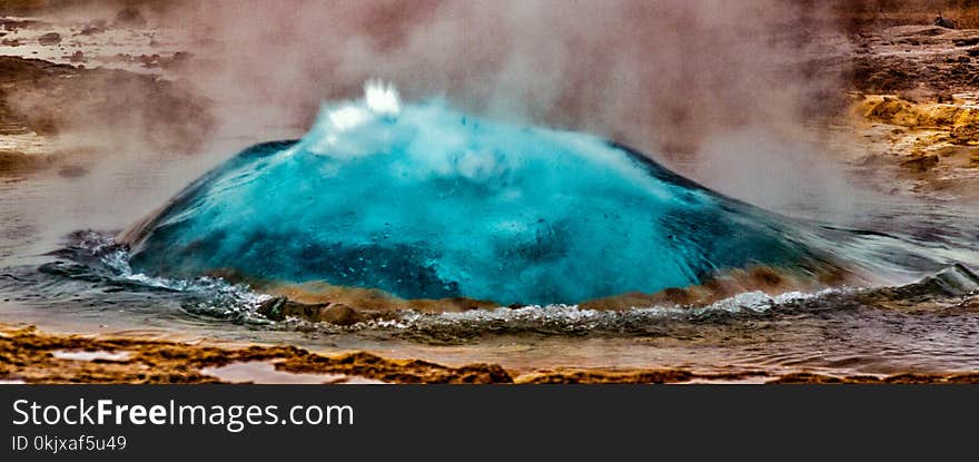 Geyser in Iceland begins eruption by first forming a bubble of hot water, before bursting into the air. Geyser in Iceland begins eruption by first forming a bubble of hot water, before bursting into the air