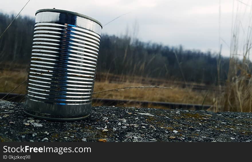 Tin Can on Gravel Surface