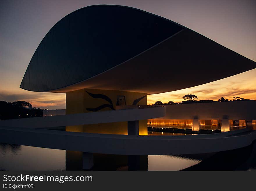 Black and Yellow Building during Orange Sunset