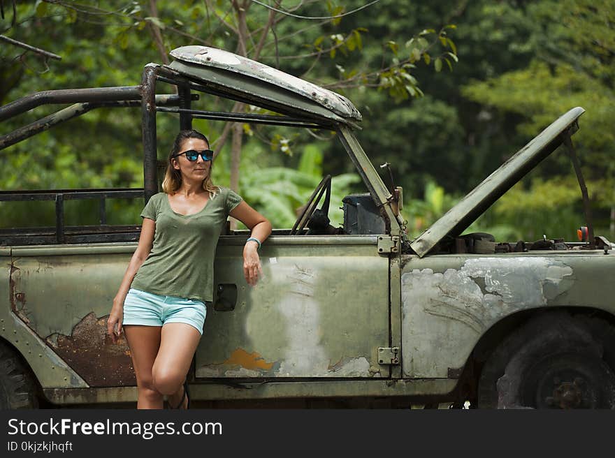 Woman Leaning on Wrangler With Hood Open