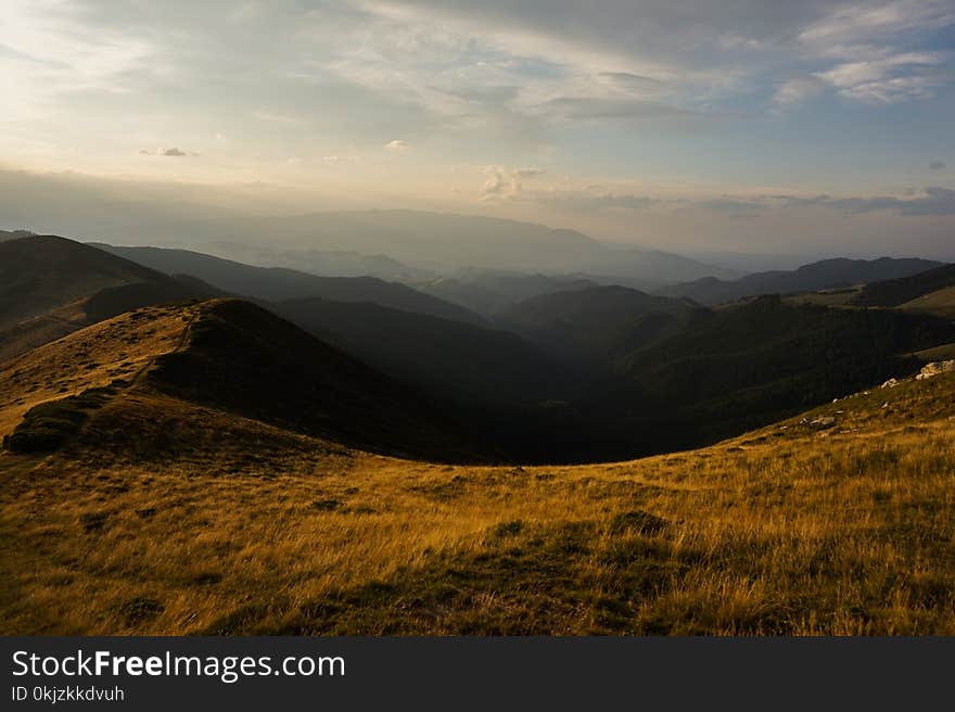 Grass Field Near Mountain