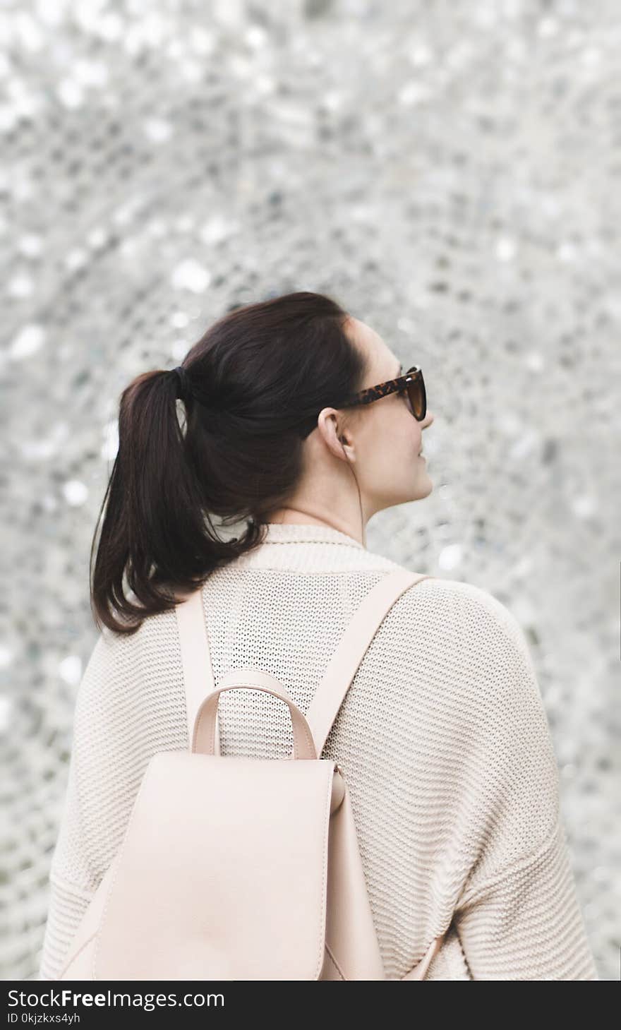 Woman Wearing White Sweatshirt and Backpack