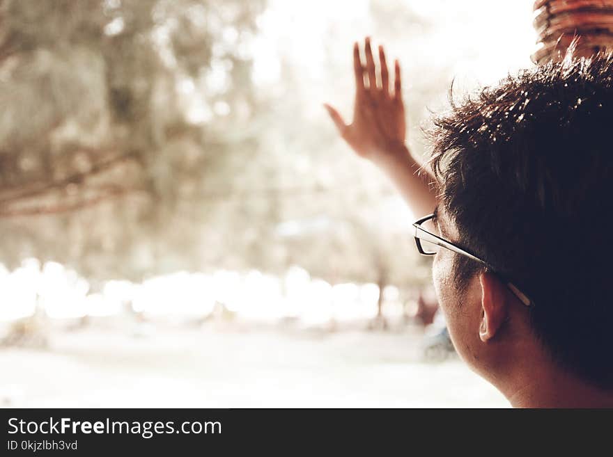 Person Wearing Black Framed Eyeglasses