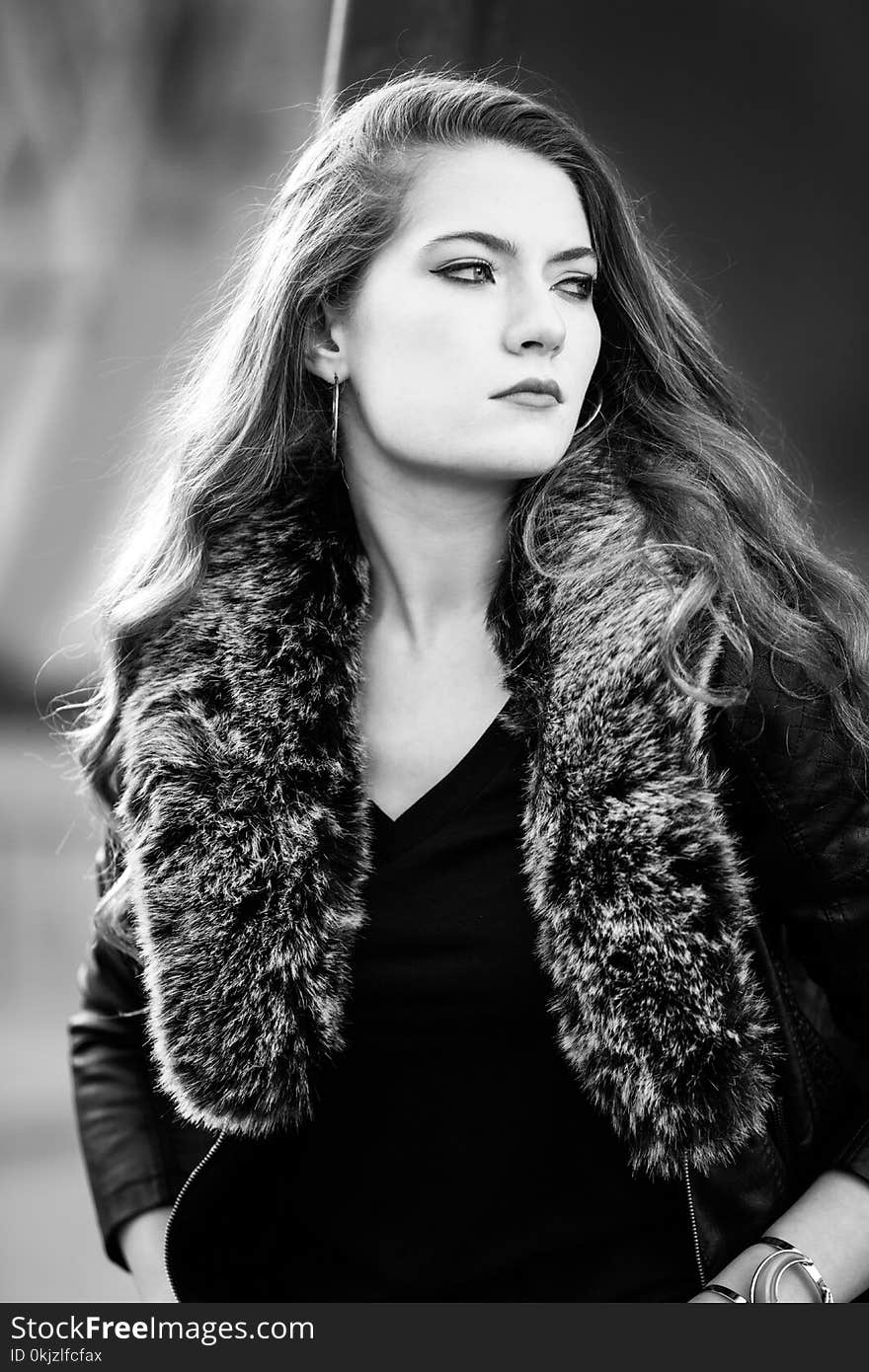 Grayscale Photo of Woman Wearing Coat