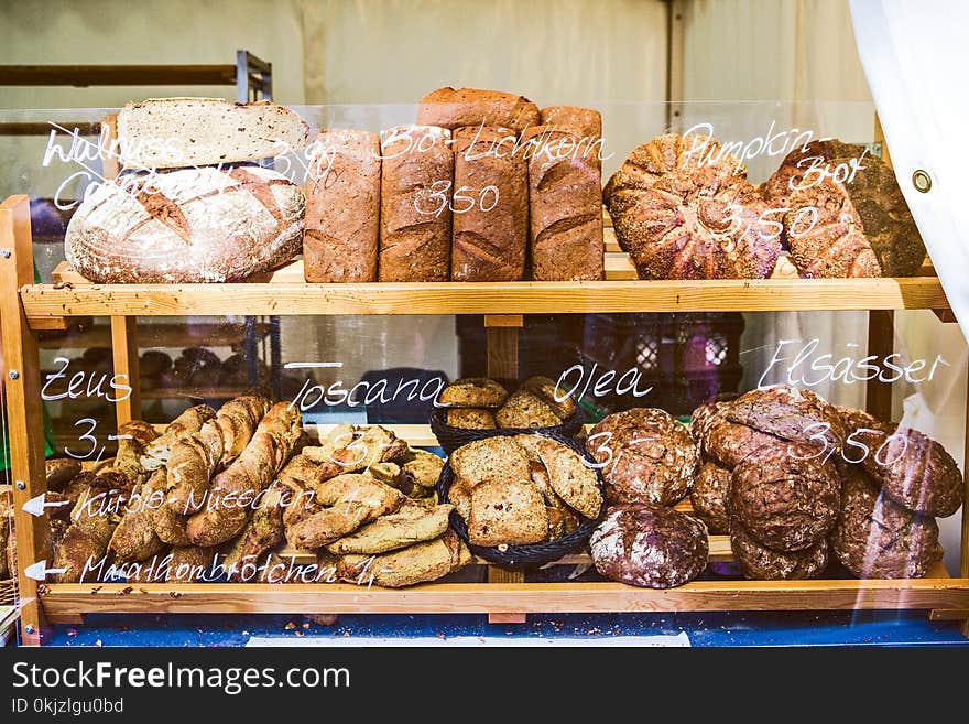 Brown Wooden Rack With Baked Bread Displayed