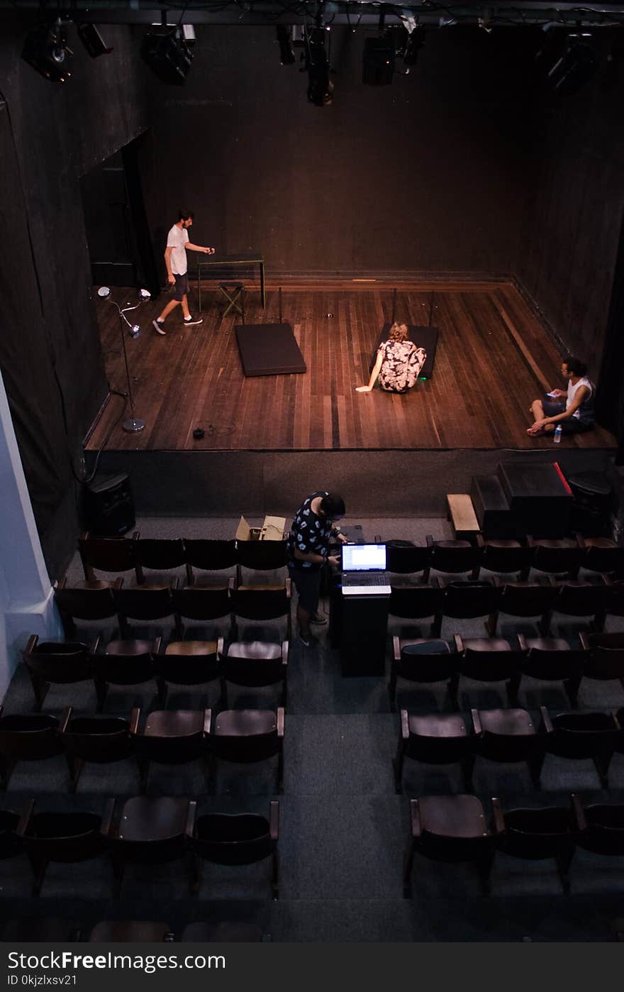 Man Standing on Stage