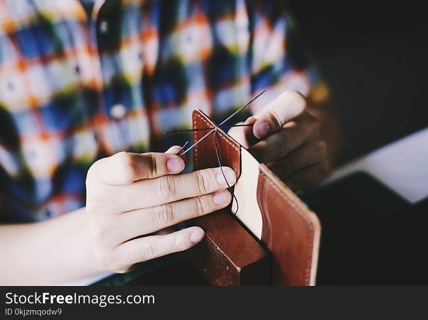 Person Knitting Brown Leather Textile